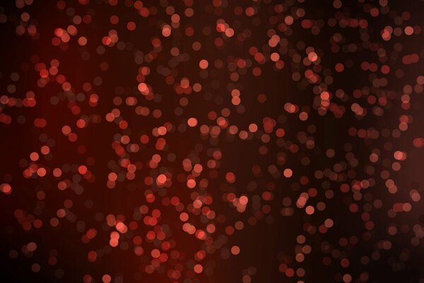 Red sequins on a black background