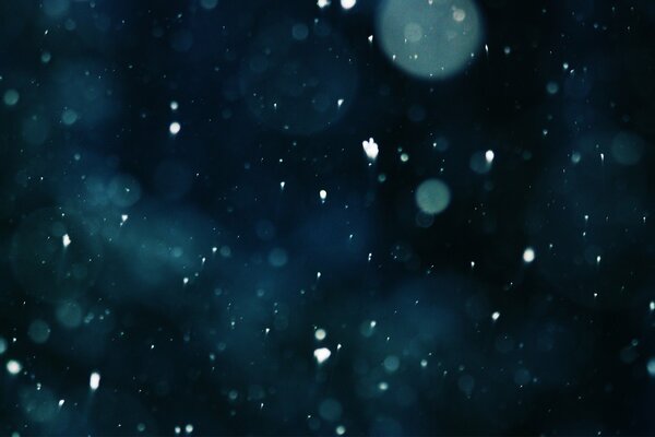 White snow on a black background