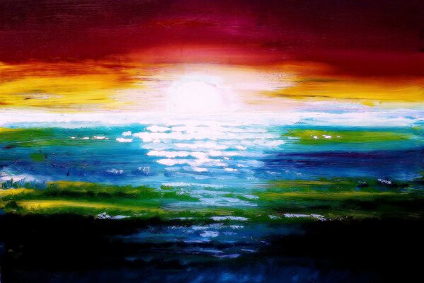 Zachód słońca wszystkimi kolorami tęczy nad morzem