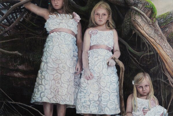 Three little girls are standing in the roots