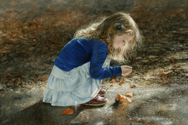 A little curly-haired girl collects leaves