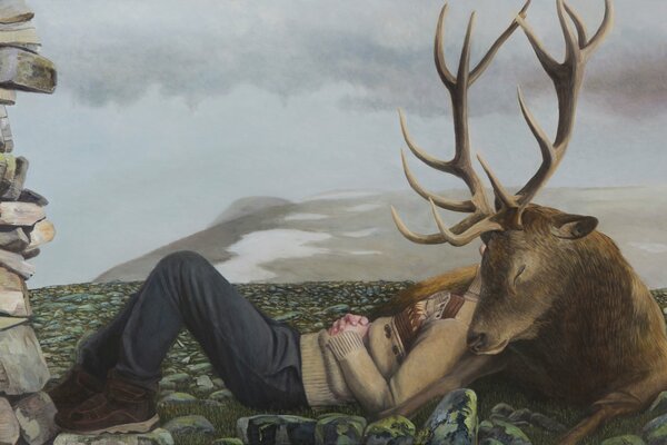 A man is lying on a deer