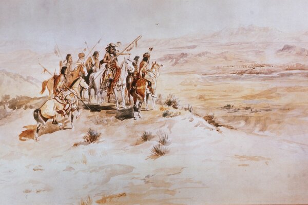 Люди с оружием на лошадях в пустыне