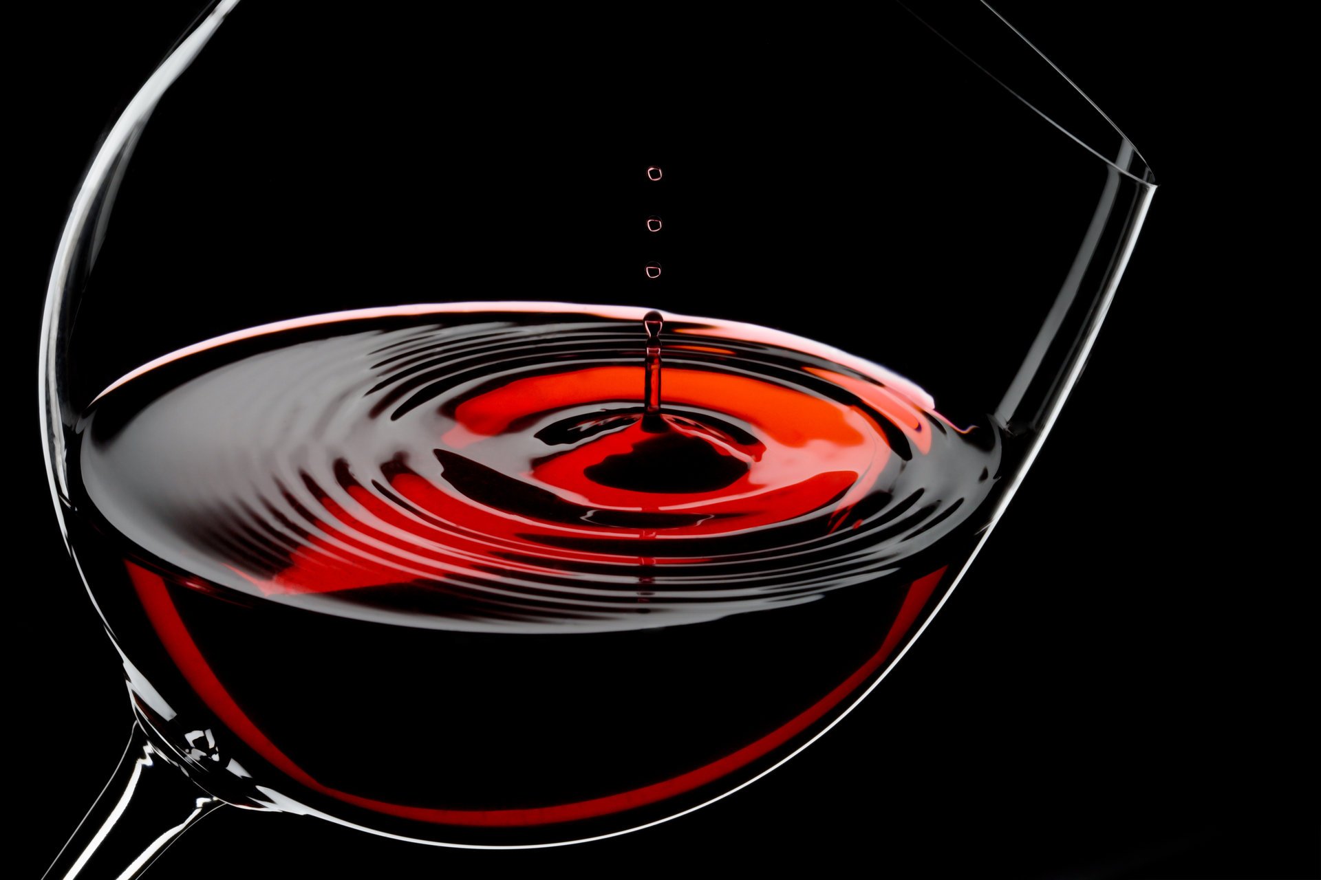 wine red drops glass glass black background