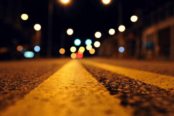 Night road photo macro. Bokeh effect on the road photo