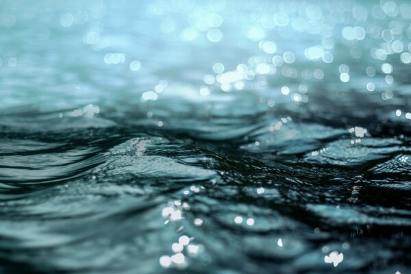 The surface of the water with reflections of light