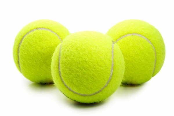 Three tennis balls on a white background