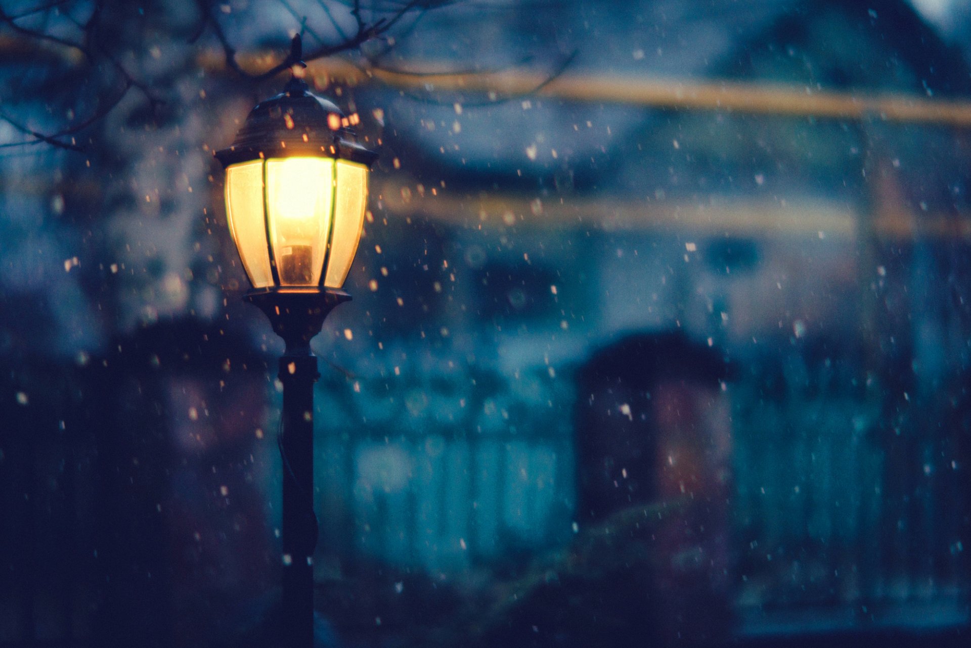 lantern light lighting night snow winter trees houses fence