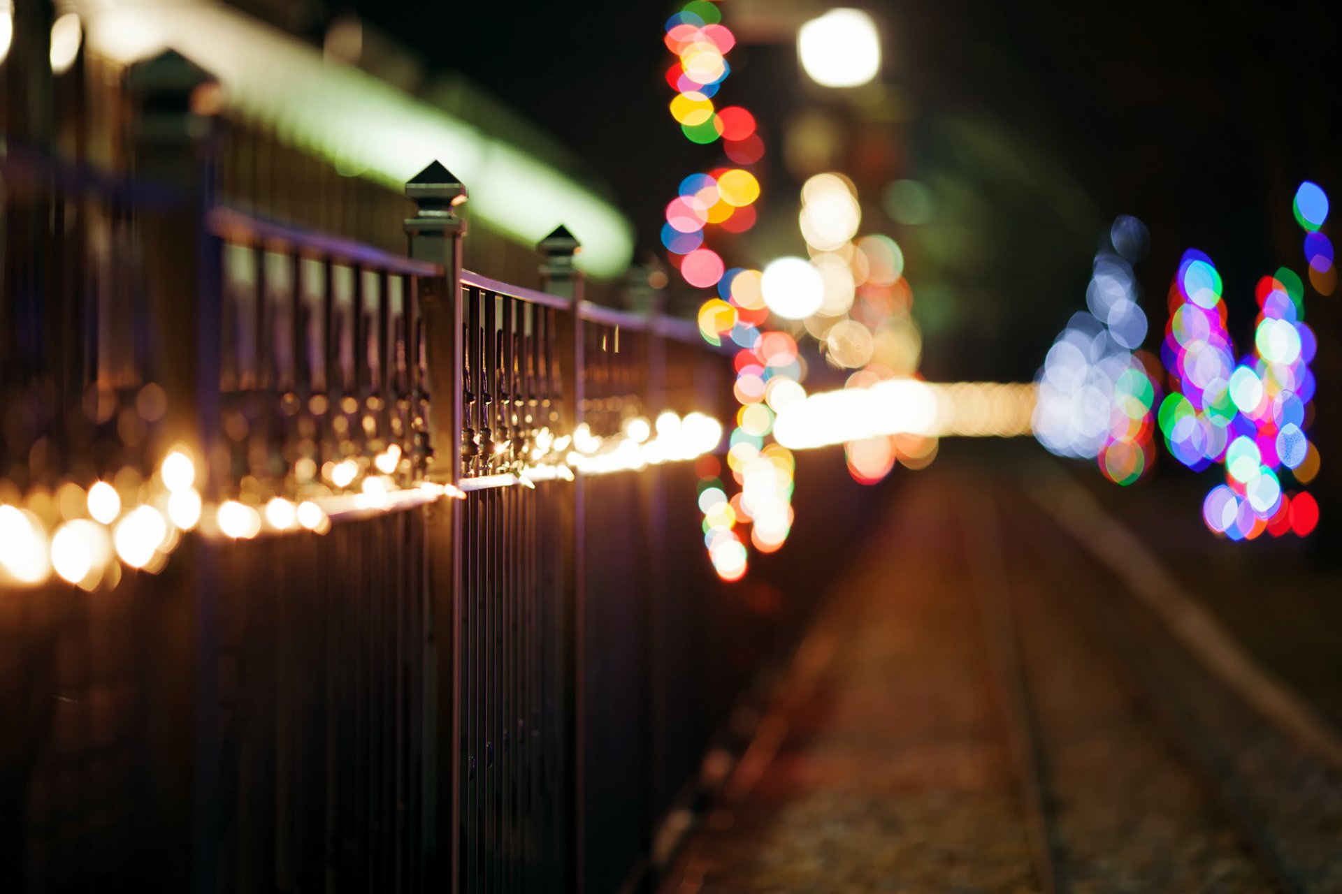 fence fence rods iron metal garland holidays winter road lights multicolored bokeh