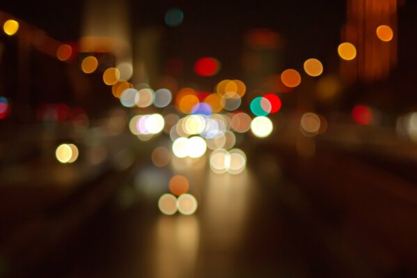 Title blurred multicolored lights on the road