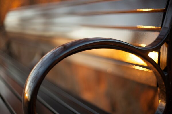 A bench against the background of a golden sunset