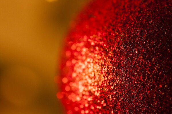 Macro shot of a Christmas ball. Rough surface of a Christmas tree toy