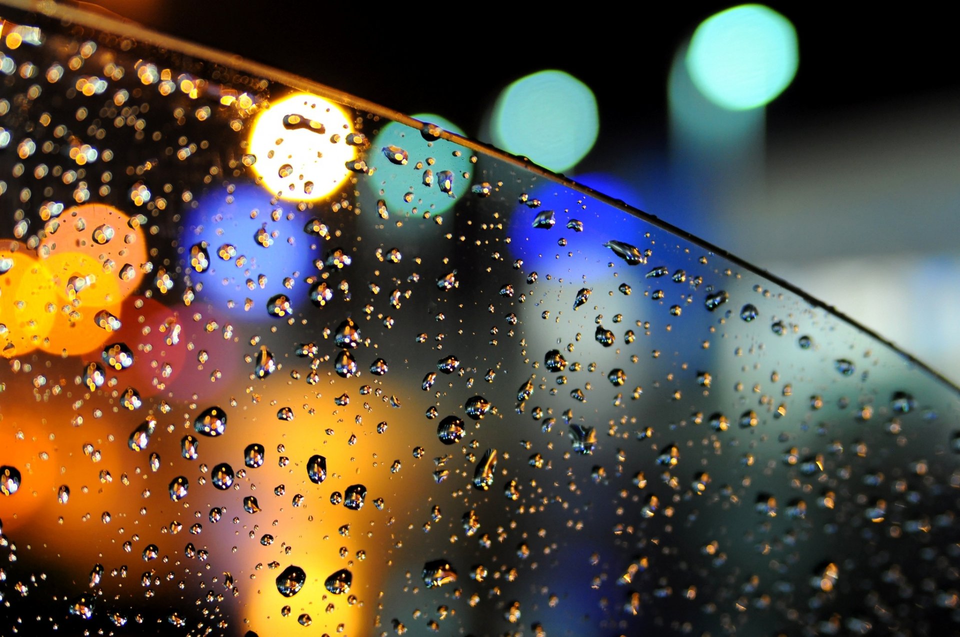 bokeh luces vidrio coche gotas agua lluvia