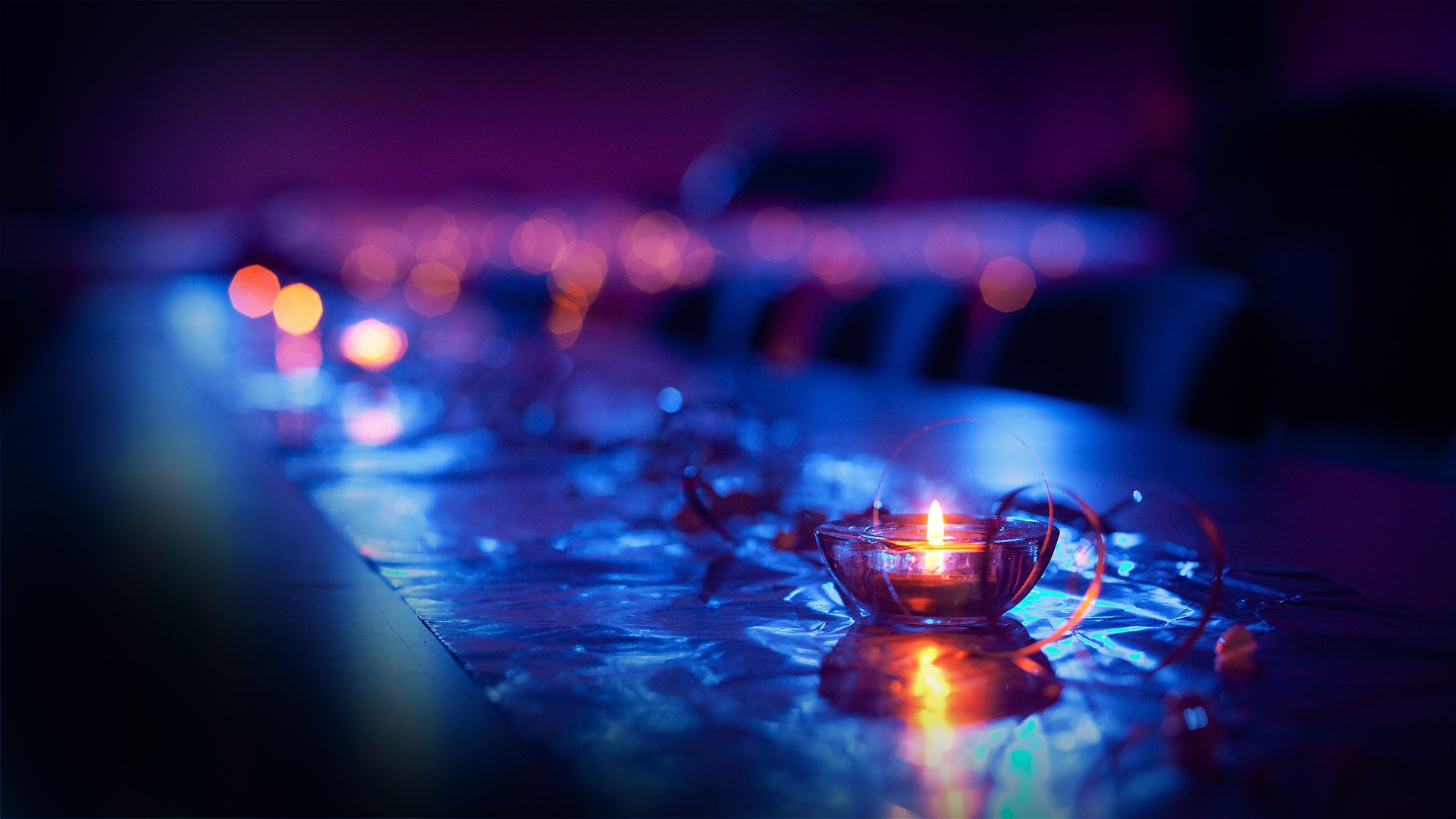 close up blue candle lights bokeh