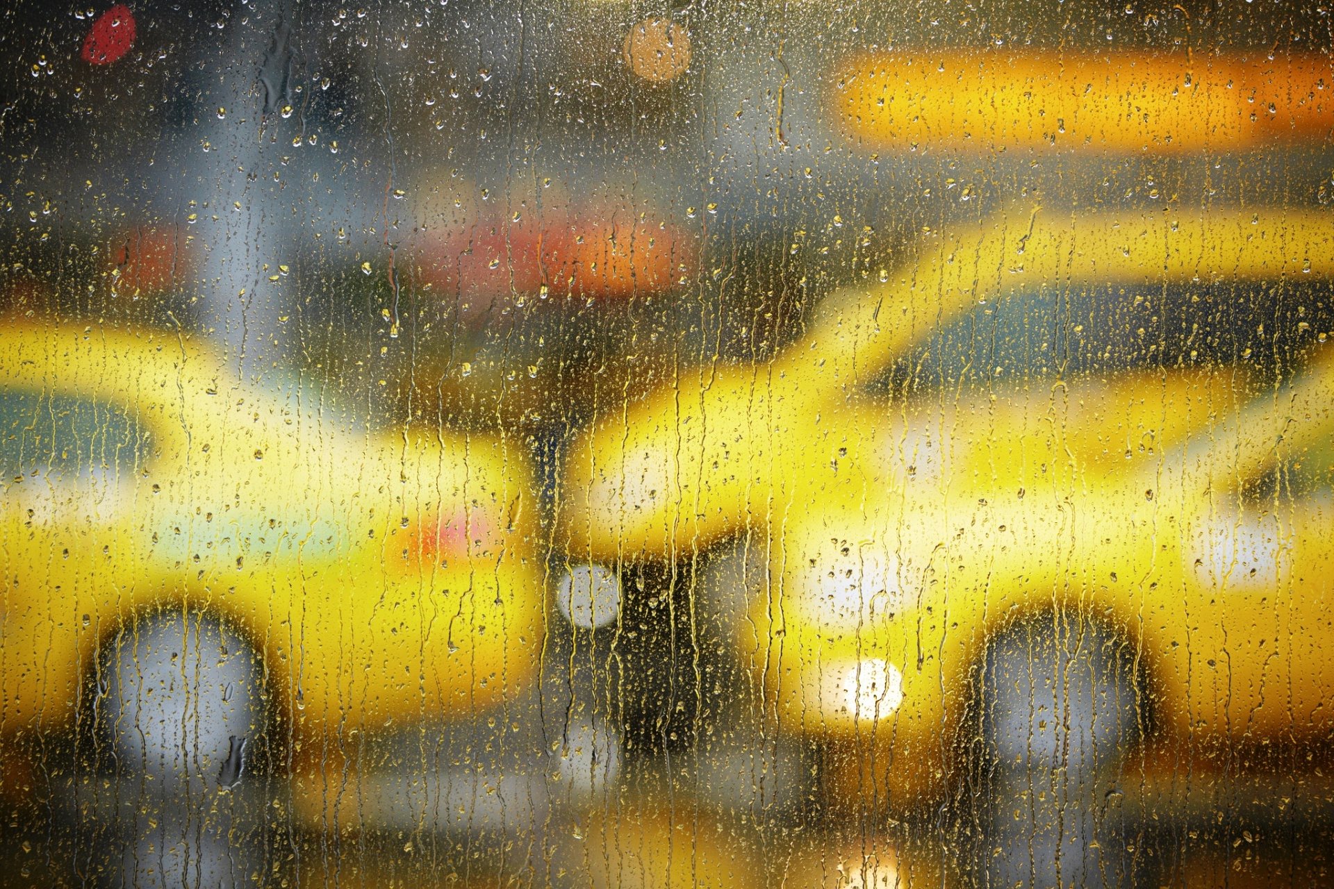 glass window drops rain bokeh taxi machinery road town