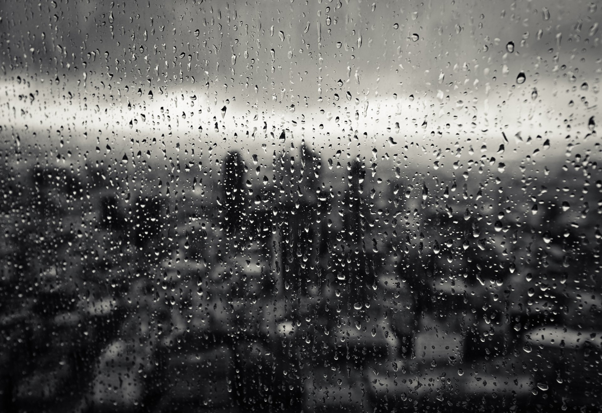 gotas vidrio lluvia ventana ciudad macro