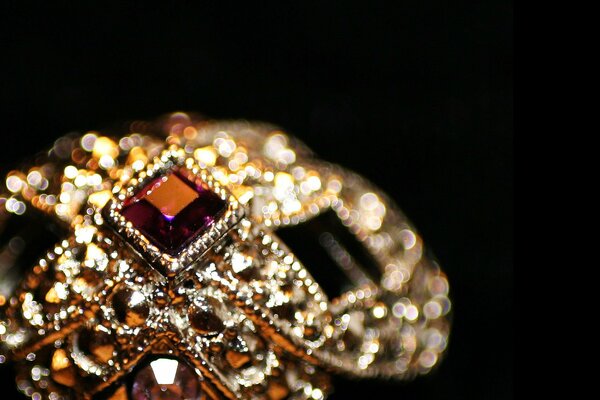 Golden ring with brown precious stones
