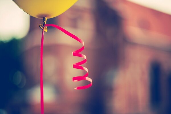 Balloon with colored ribbon