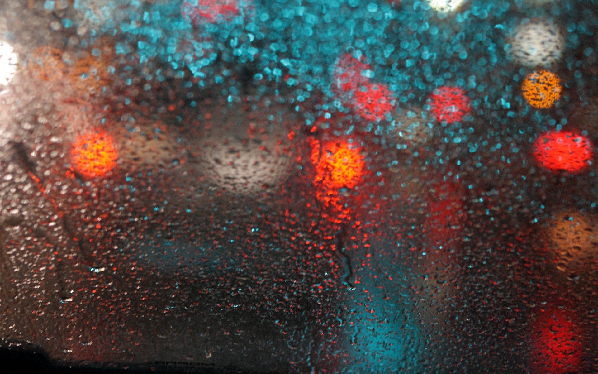 close up glass drops rain reflection