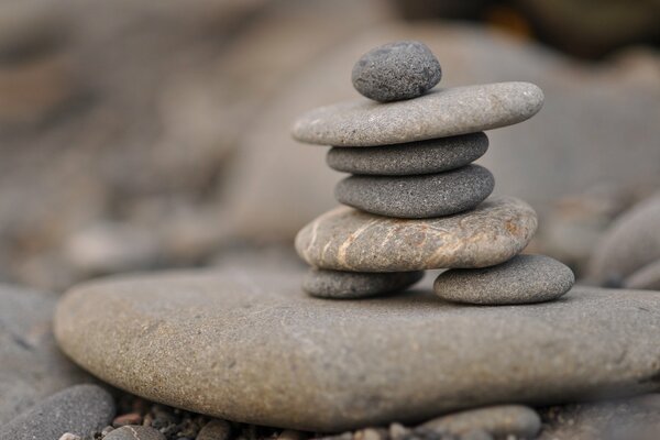 A pyramid of flat stones in macro