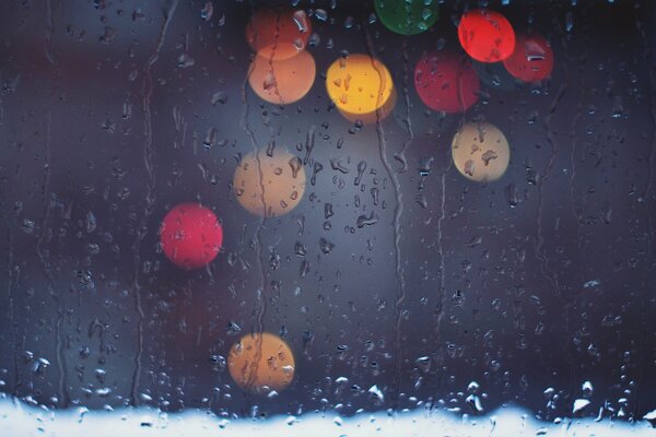 Colored lights on wet glass