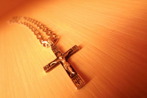 Hanging cross on a chain under the macro