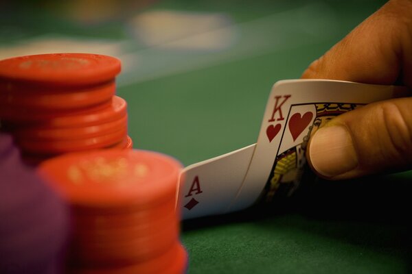 Playing cards on a green table