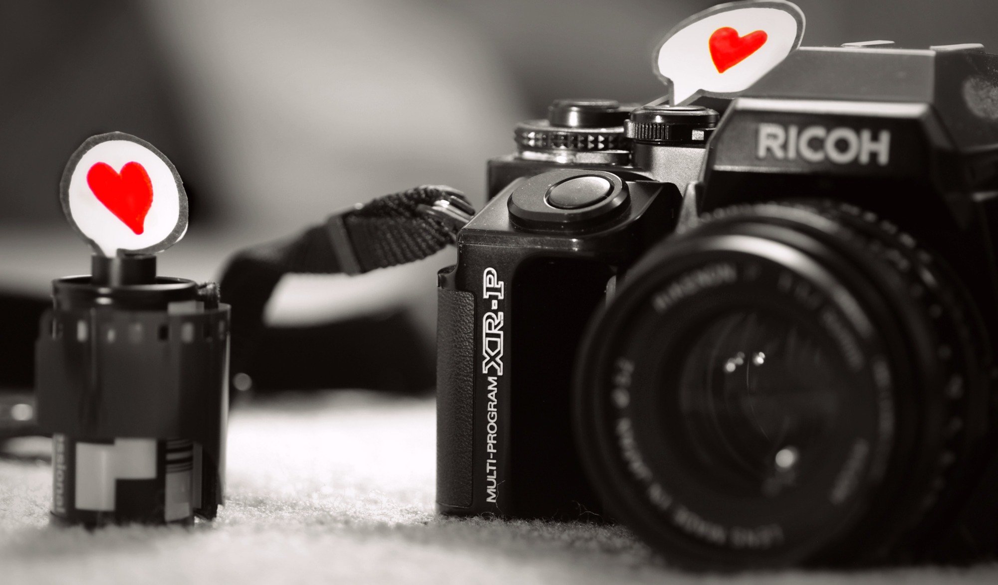 close up love heart feeling paper black and white a camera the camera lens gray background film