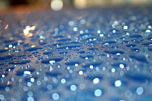 Raindrops on blue glass