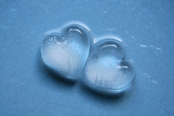 Heart-shaped drops on a blue background