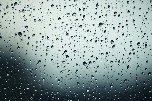 Cloudy weather. Raindrops on the glass