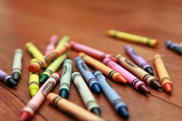 Colorful wax pencils on the table