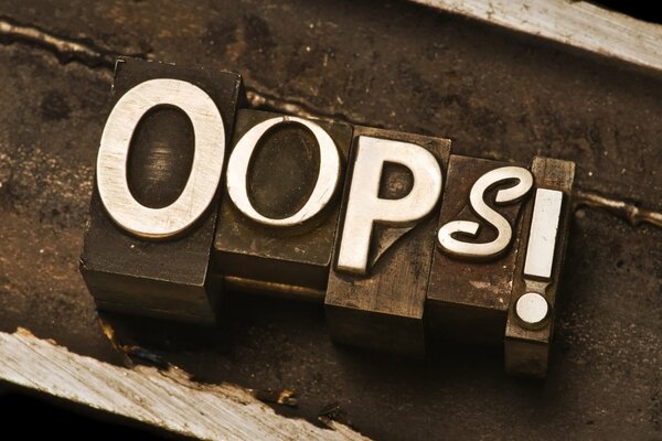 The word oops consists of typographic font letters. Macro