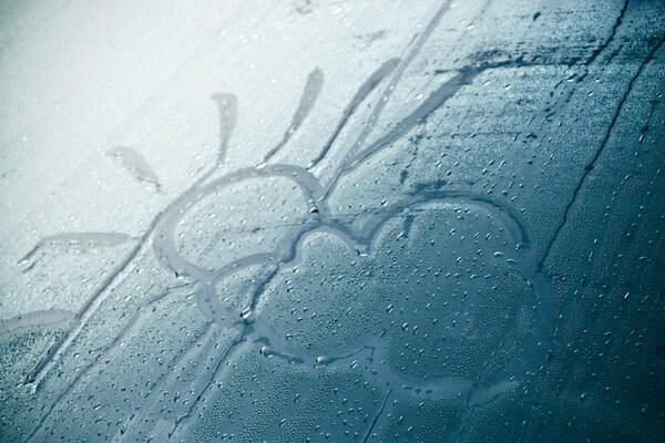 Children s drawing on fogged glass