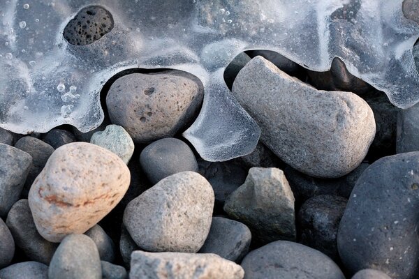 Thin brittle ice on the rocks