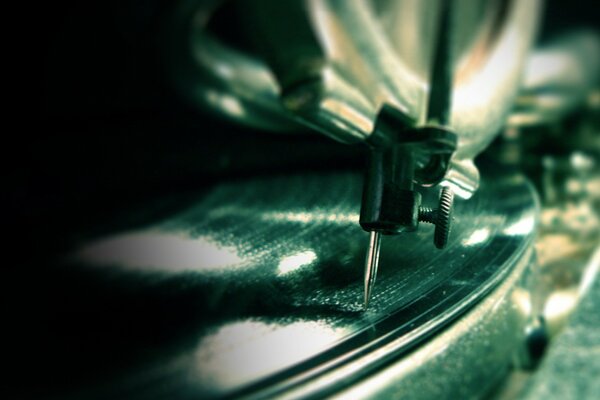 Macro photography of the needle of the vinyl record player