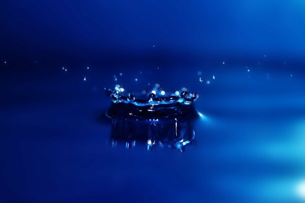 Drops fell into the water. Blue background
