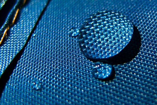 A large drop on a blue cloth