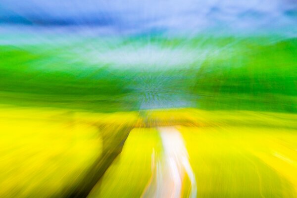 Blurred natural landscape with a field