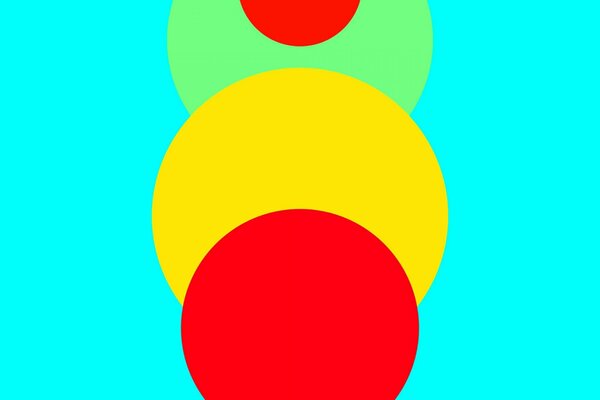Sobre un fondo azul, un círculo rojo amarillo y verde