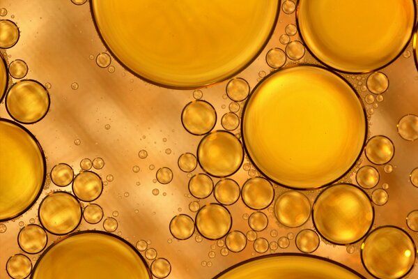 DIFFERENT BUBBLES AND BALLS ON A YELLOW BACKGROUND