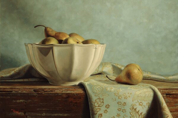 A vase of pears on the table