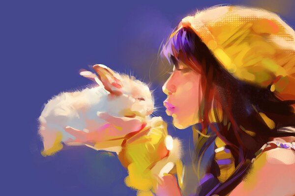 A girl kisses a fluffy rabbit