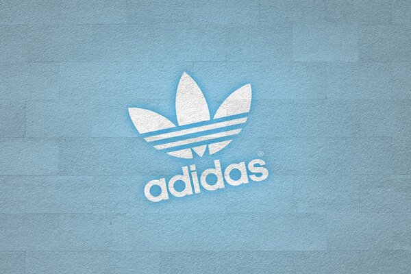 Logo firmy Adidas niebieskie tło