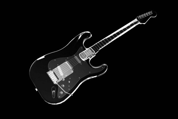 Elegant black guitar on a black background