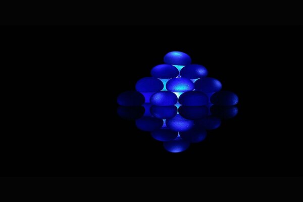 Blue balls form a rhombus in a black background