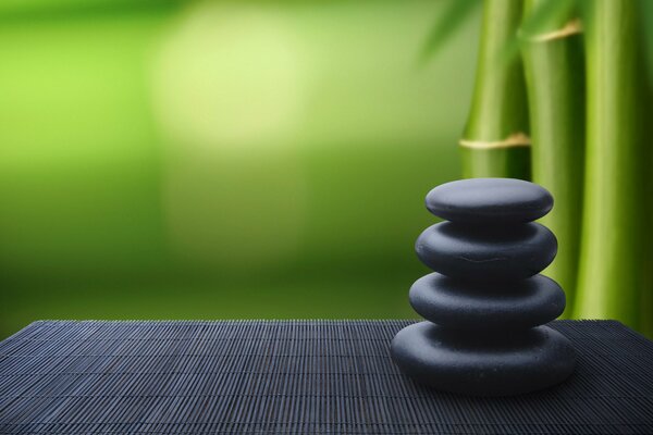 A stack of black stones on the table