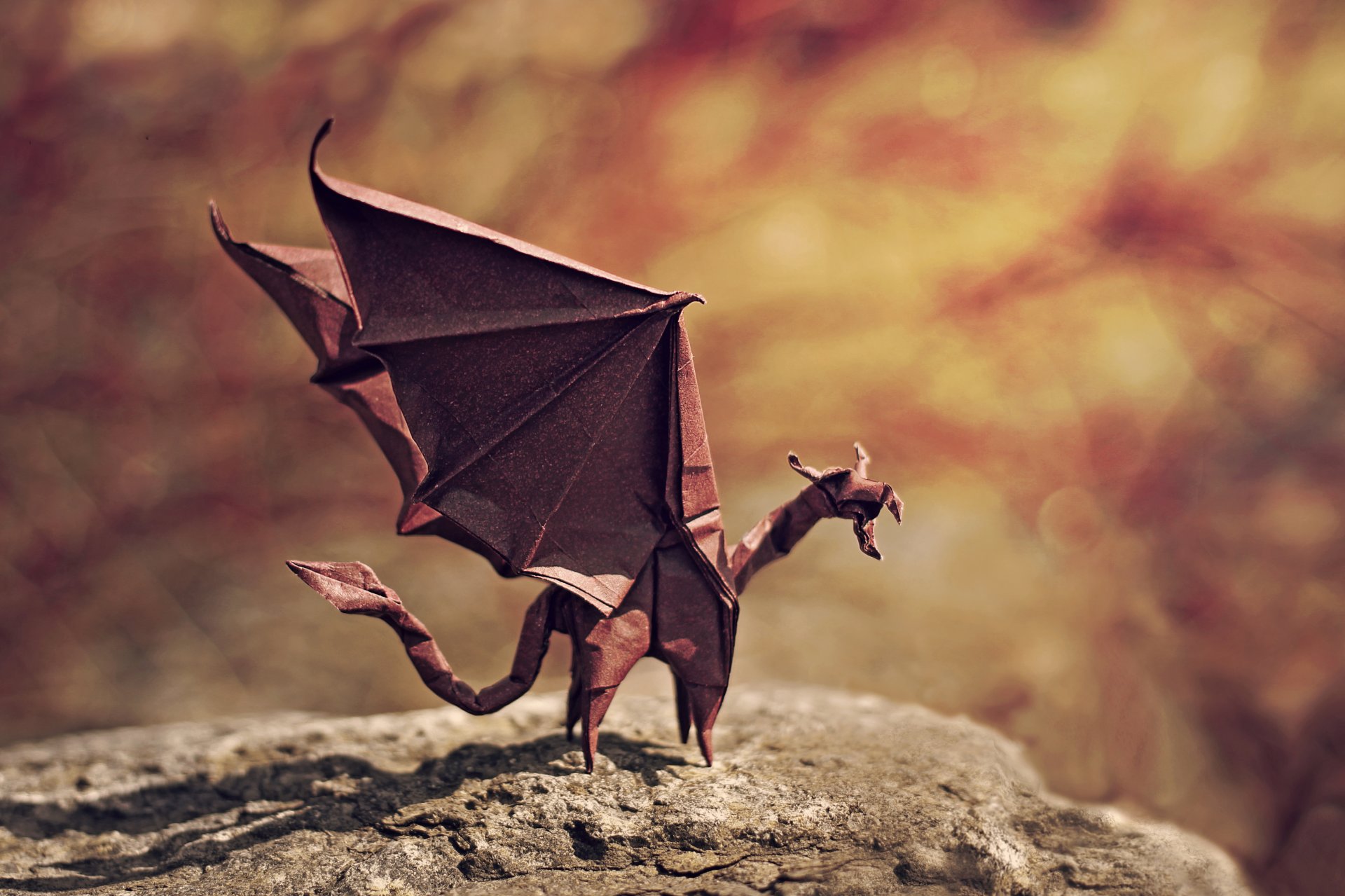 origami drache flammendrache flügel wütend rock bokeh schatten