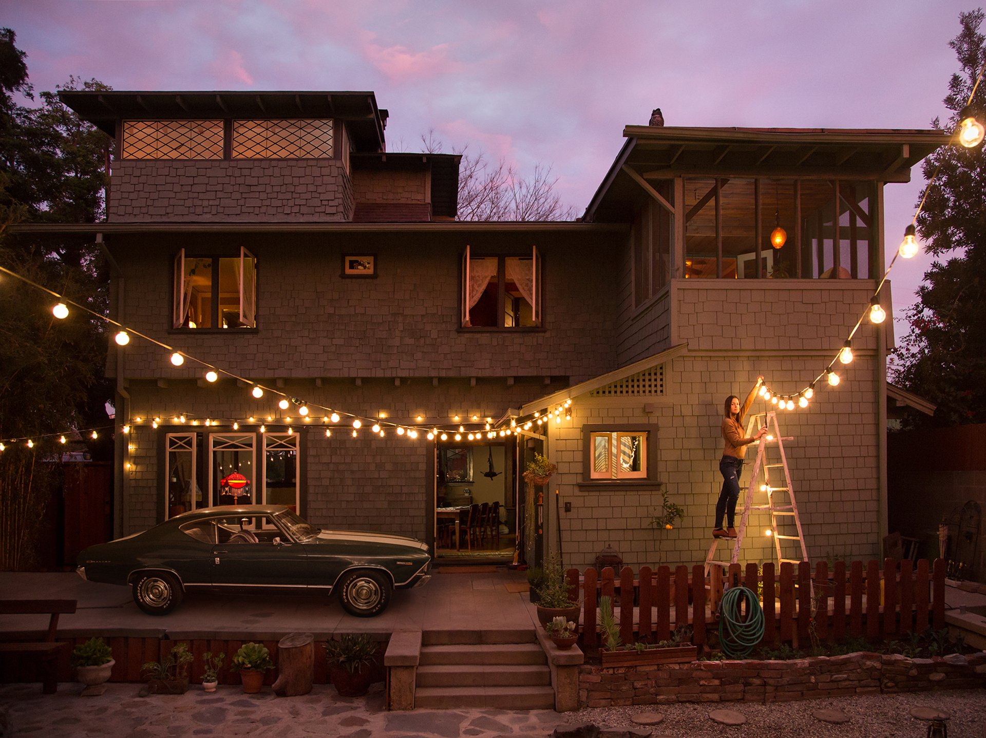 ryan schude photographer house machine girl hangs flashlights garland night lights lighting