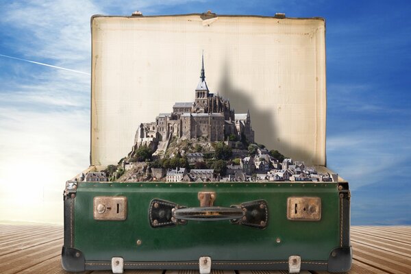 A creative suitcase with towers and a city